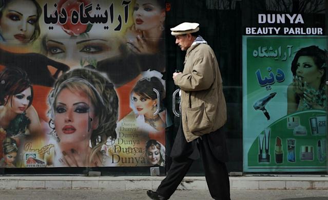 Images of women at Kabul beauty salon painted over as Taliban take over