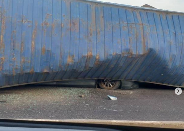 container falls on car